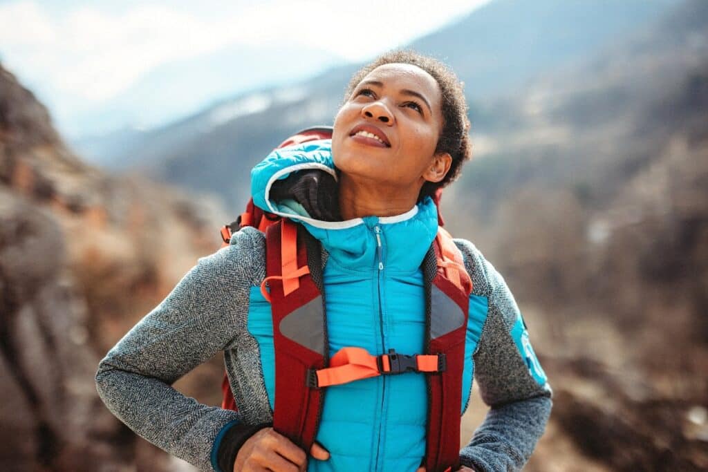 A woman enjoying a hike in the mountains