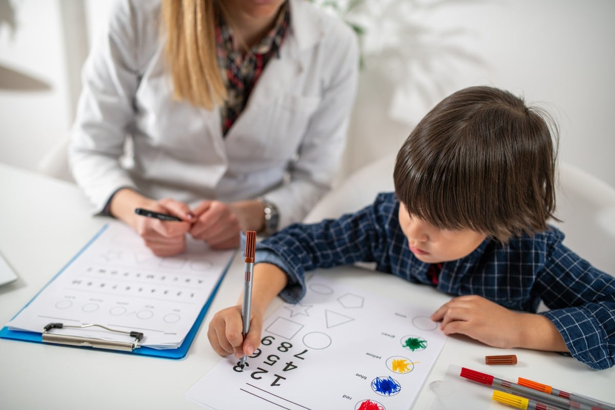 A boy completing a psychological evaluation in Naperville